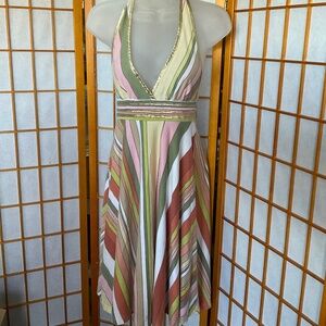 Mixed width striped flare dress in muted tones with gold accents